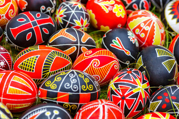 Traditional ornamets on Easter egg -Ukrainian pysanka.Mix of colored easter eggs with the traditional ukrainian slavic designs.Preparation for Christian holiday.