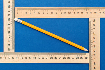 Pencil and wooden measuring ruler