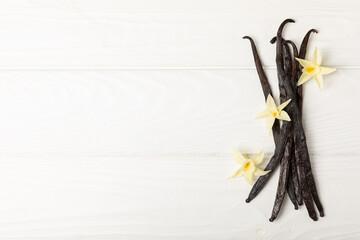 Vanilla pods on a textured background. Vanilla flowers and seeds. vanilla stick bean. Aromatic...