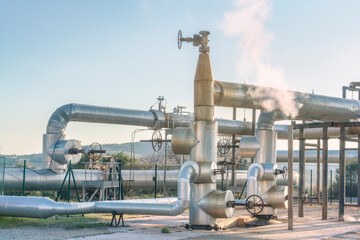 Geothermal energy. Pipelines of a plant in Larderello, Tuscany region, Italy