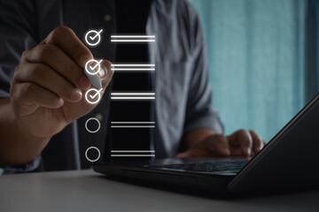 Businessman use pen to tick correct sign mark in checkbox for quality document control checklist business approve project. Quality control management validation process. Quality assurance improvement.