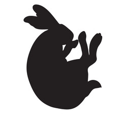 A solid black silhouette of a rabbit. The rabbit is positioned in profile view, curled up. Its large ears stick out, and its body is round and full.