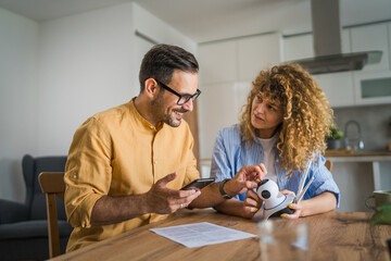 Couple at home connect and install cctv security surveillance camera