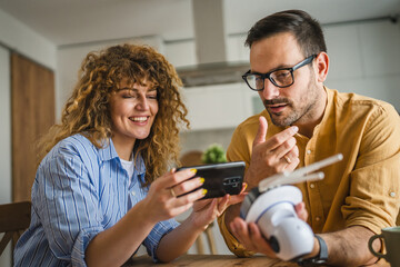 Couple at home connect and install cctv security surveillance camera