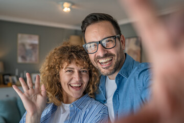 Fototapeta premium Happy adult caucasian couple at home husband and wife family concept