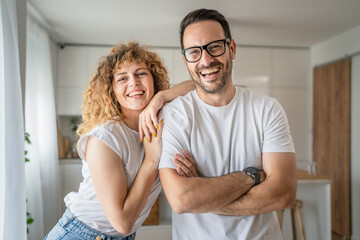 Happy adult caucasian couple at home husband and wife family concept