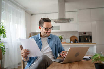 one man adult caucasian work on laptop at home happy smile