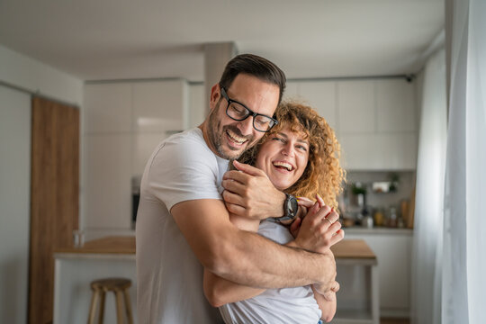 Happy adult caucasian couple at home husband and wife family concept