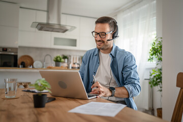 One man caucasian male freelancer work from home on laptop computer