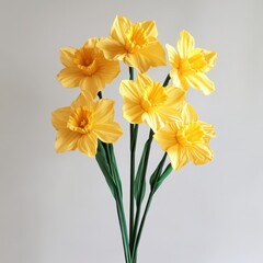 Fototapeta premium Yellow daffodils floral arrangement on white background