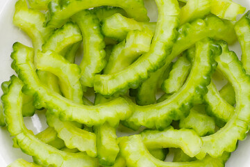 Bitter melon on yellow background.