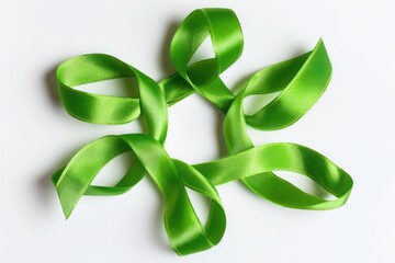 A green ribbon arranged in a circular pattern isolated on white background