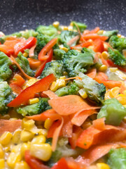 A Colorful and Delectable Vegetable StirFry Featuring Broccoli and Carrots as Main Ingredients