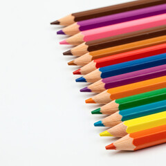 Vibrant Colored Pencils Arranged in a Row on White Background