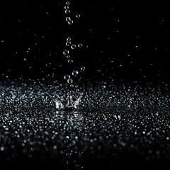Obraz premium Water drops, glossy black, slow motion, clean surface, liquid shot
