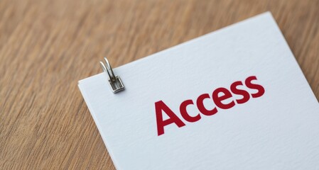 Red Access Word on White Paper Close Up View Wooden Background