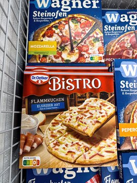Frozen dr. Oetker bistro flammkuchen elsasser art in a freezer next to wagner steinofen pizzas - FRANKFURT, GERMANY - APRIL 9, 2025