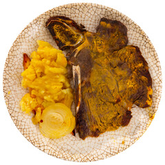 Tasty juicy beef entrecote with mashed potatoes and onion. Isolated over white background