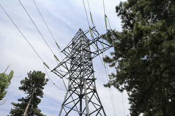 Low Angle View Of A Steel Lattice High Voltage Electricity Pylon (Transmission Tower) With Power...