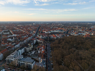 A breathtaking aerial view capturing the urban landscape, beautifully lit by the sunset Hannover List Lower Saxony