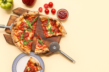 Composition with tasty pizza and cutter on beige background