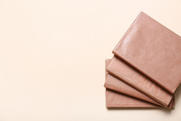 Ladder made of books on beige background