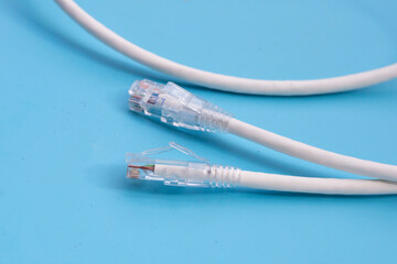 LAN network connection ethernet cables on blue background.