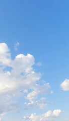 Obraz premium Soft, pale blue sky dotted with fluffy white cumulus clouds, meteorology, texture, fluffy