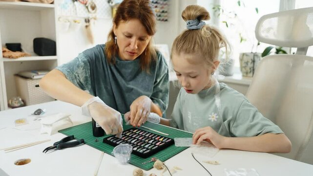 Close-up of trendy handmade jewelry resin production. Detailed resin work creates elegant accessories, emphasizing artisanal techniques and contemporary fashion trends in DIY jewelry making.