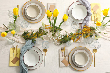 Elegant table setting with beautiful flowers and candles in restaurant, top view