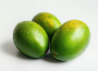 Fresh and Juicy Green Mangos with Water Droplets on White Background, Perfect for Healthy Recipes or Tropical-Themed Designs and Food Photography