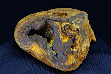 Sample of limonite (iron ore) on a dark background