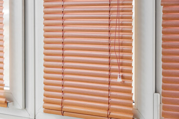 Fototapeta premium Window with closed blinds in room