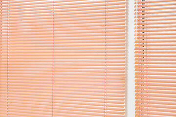 Window with closed blinds in room, closeup
