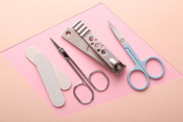 Set of different manicure tools on color background, flat lay
