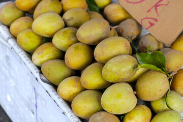 Fresh sapodilla fruits for sale at a local market in Vietnam