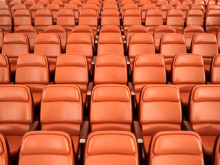 Obraz premium Empty Orange Stadium Seats Rows of Seating