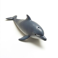 Obraz premium A gray toy dolphin, swimming in an imaginary ocean, captures the essence of marine life with its sleek form and playful charm.