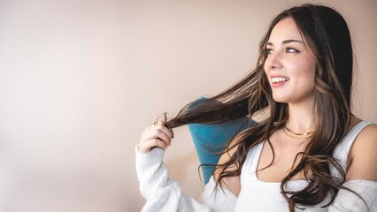 Fototapeta premium Young beautiful woman sitting at home relaxing