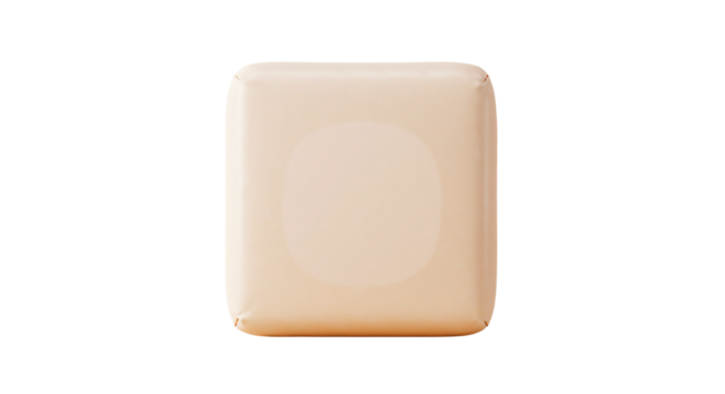 A single square block with a light peach color sitting against a black background in a studio shot