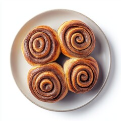A top view of a plate of freshly baked cinnamon swirl bread, isolated on a white background 