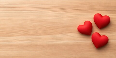 Fototapeta premium Three Red Hearts on Wooden Background