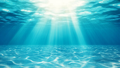 Underwater scene with shimmering blue sea, light rays penetrating surface, creating tranquil and serene atmosphere