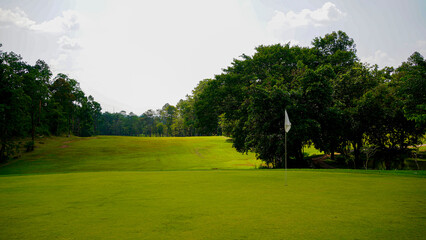Beautiful golf course in a sunny day. Background evening golf course has sunlight shining down.