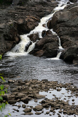 A waterfall flowing into a river.