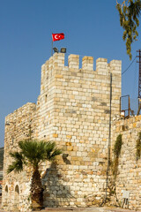 Restored castle bastion,with Turkish Flag, in Izmir, Foca, of Turkey