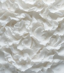 Obraz premium A close-up view of delicate white tissue paper, showcasing its soft, crinkled texture and subtle translucence. The light gently illuminates its fibers, creating a serene and elegant appearance.