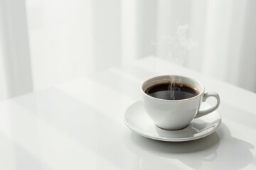 Aromatic Steam Rising From a Cup of Dark Coffee on a Bright White Table