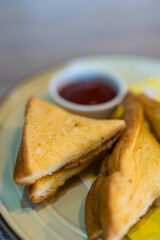 Handmade sandwiches on garlic bread triangles, close up