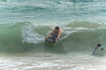 boogie boarding at Poipu beach 